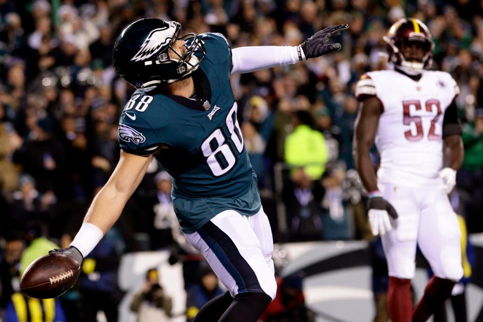 Philadelphia Eagles tight end Dallas Goedert (88) spikes the ball after scoring a touchdown against the Washington Commanders during the first quarter of an NFL football game, Sunday, November 14, 2022, in Philadelphia.