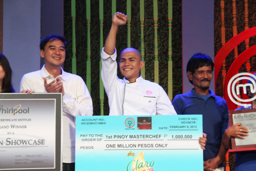 JR accepts his award as first Pinoy MasterChef