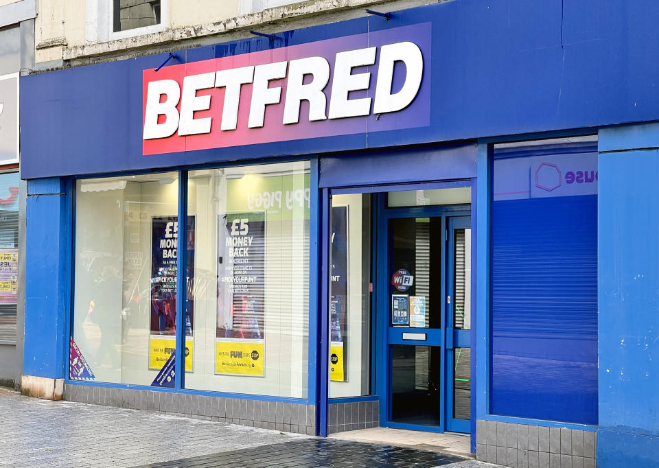 Merthyr Tydfil, Wales - May 2021: Exterior view of the front of a branch of Betfred chain of betting shops.