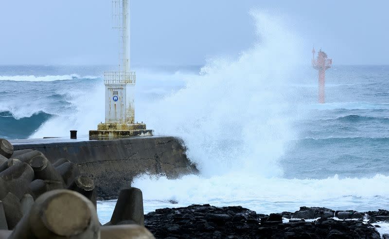 A high wave caused by typhoon Khanun hits a seawall in Seogwipo on Jeju island