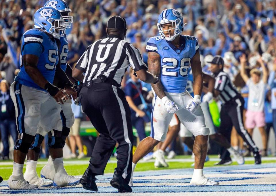 North Carolina running back Omarion Hampton (28) reacts after scoring a touchdown on a 2-yard run in the second quarter against Miami on Saturday, October 14, 2023 at Kenan Stadium in Chapel Hill, N.C.