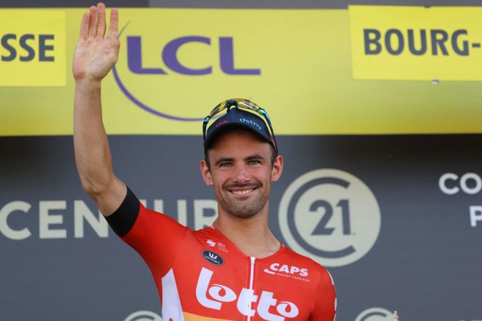 Lotto Dstnys Belgian rider Victor Campenaerts celebrates on the podium with the most combative riders award after the 18th stage of the 110th edition of the Tour de France cycling race 184 km between Moutiers and BourgenBresse in the French Alps on July 20 2023 Photo by Thomas SAMSON  AFP Photo by THOMAS SAMSONAFP via Getty Images