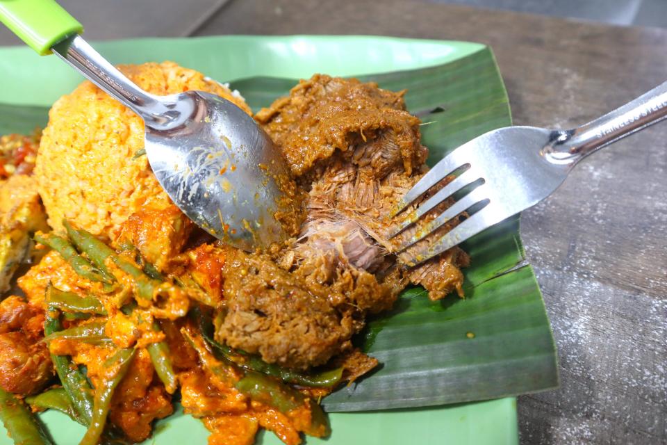 best-rated nasi padang - peeling beef apart