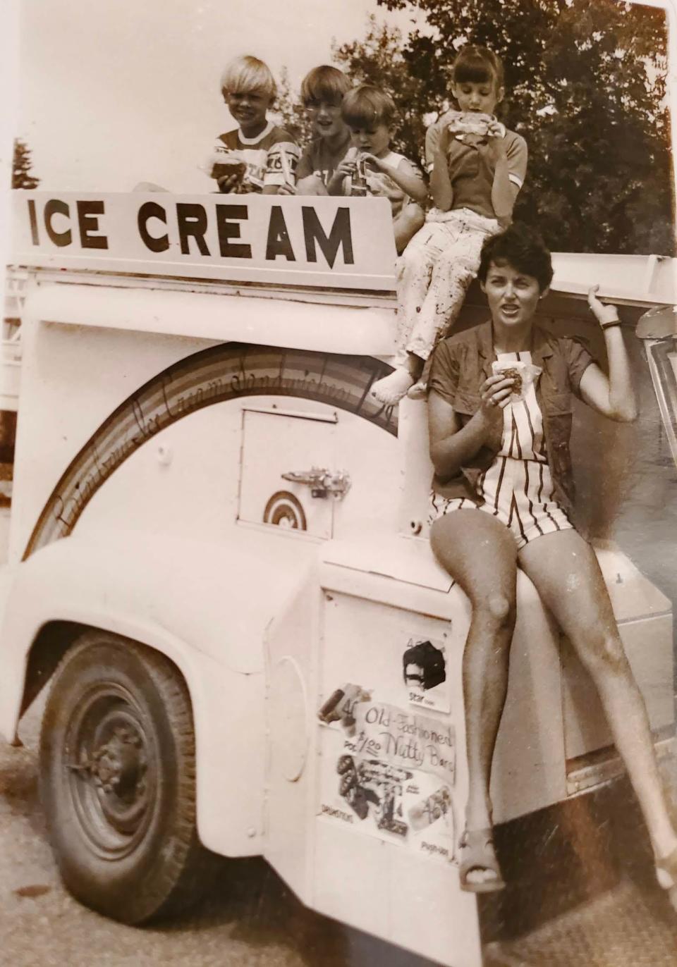 Kate Shaw of Spirit Lake, Iowa with her children (from left to right) Jeff, age 10, Justin, age 9, Todd, age 5, and Roberta, age 7. They're sampling the new Krazy Kate ice cream sandwich in 1985 while sitting on their 1967 Ford F-250 truck.