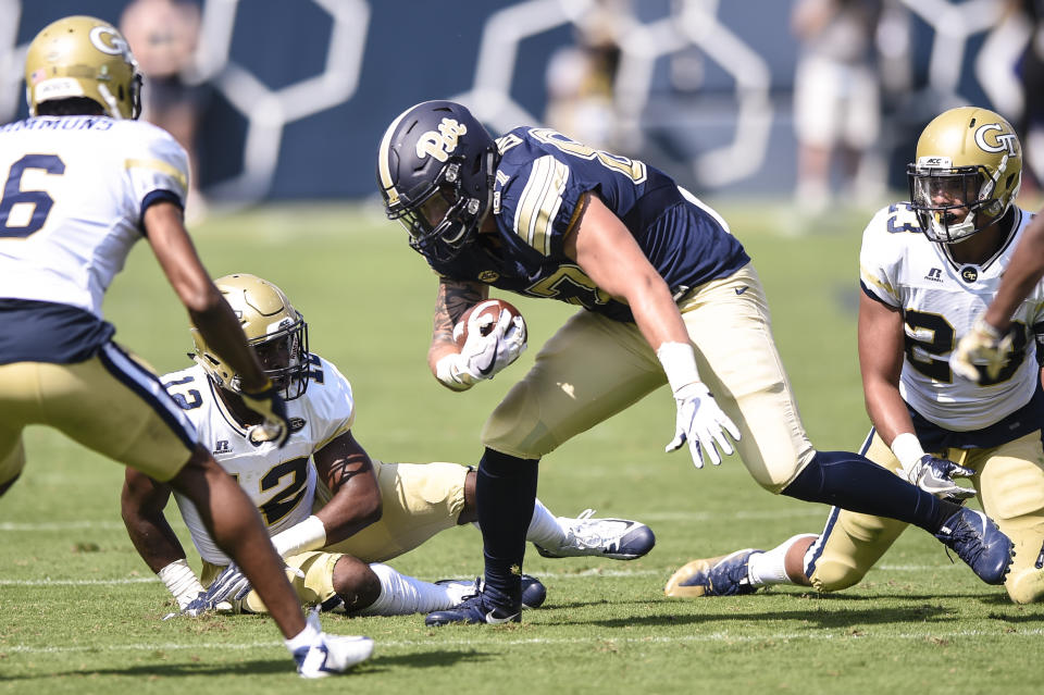 Pittsburgh tight end Chris Clark (87) tries to avoid Georgia Tech defensive back Lamont Simmons (6), linebacker Bruce Jordan-Swilling (12) and Georgia Tech defensive back Jalen Johnson (23) during the second half of an NCAA college football game, Saturday, Sept. 23, 2017, in Atlanta. (AP Photo/Jon Barash)