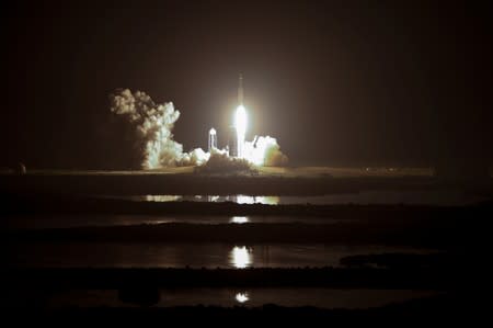 A SpaceX Falcon Heavy rocket, carrying the U.S. Air Force's Space Test Program 2 Mission, lifts off from the Kennedy Space Center in Cape Canaveral, Florida