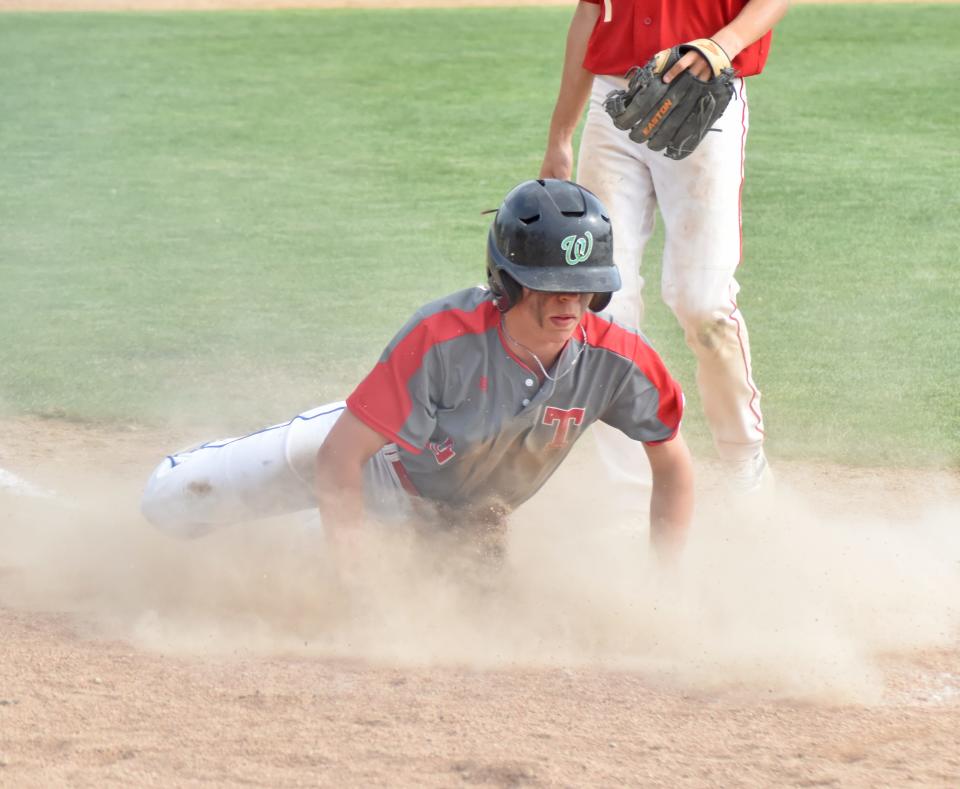 Tekonsha's Bo Veenkant slides safely home to score a run for the Indians on Friday.