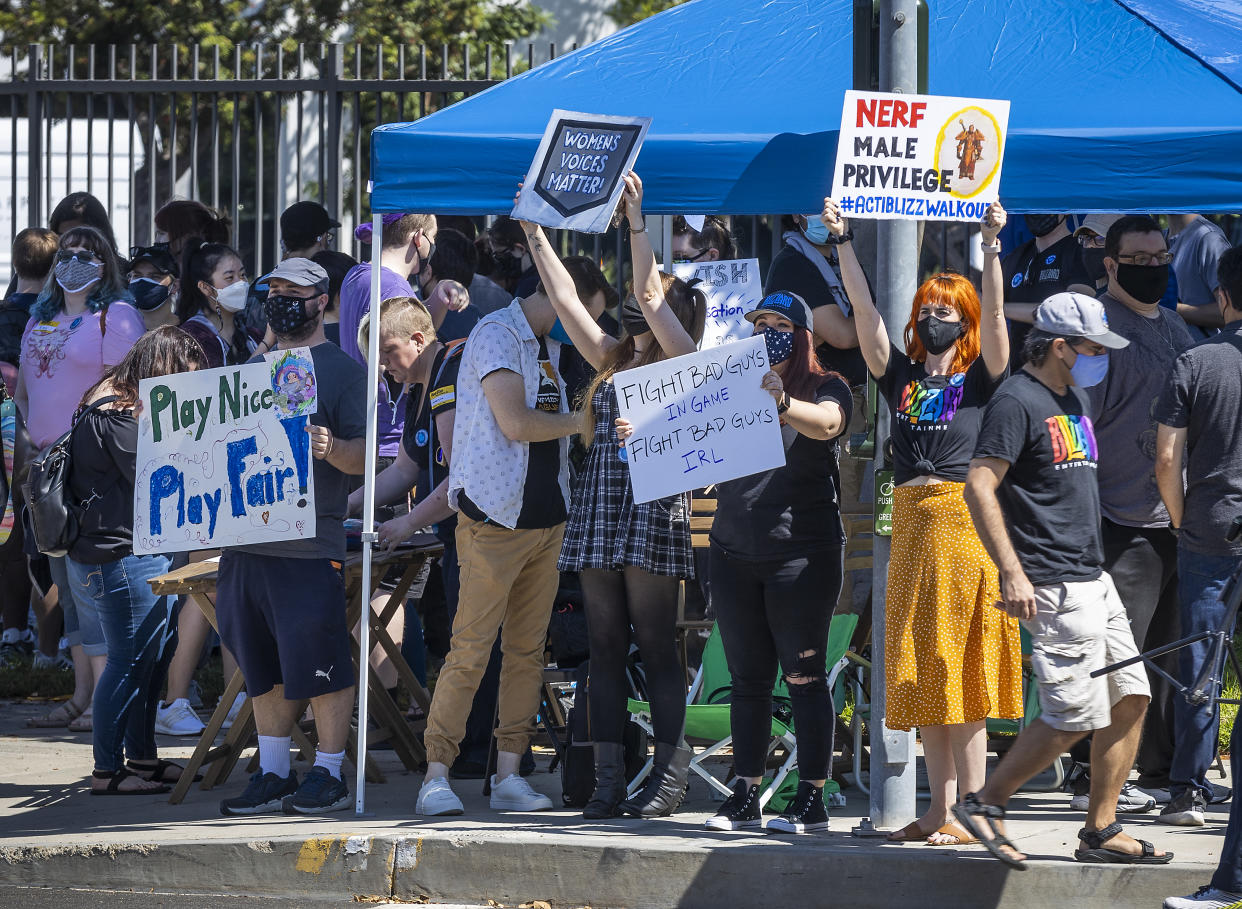 Irvine, CA - July 28: Several hundred Activision Blizzard employees stage a walkout which they say is in a response from company leadership to a lawsuit highlighting alleged harassment, inequality, and more within the company outside the gate at Activision Blizzard headquarters on Wednesday, July 28, 2021 in Irvine, CA. (Allen J. Schaben / Los Angeles Times via Getty Images)