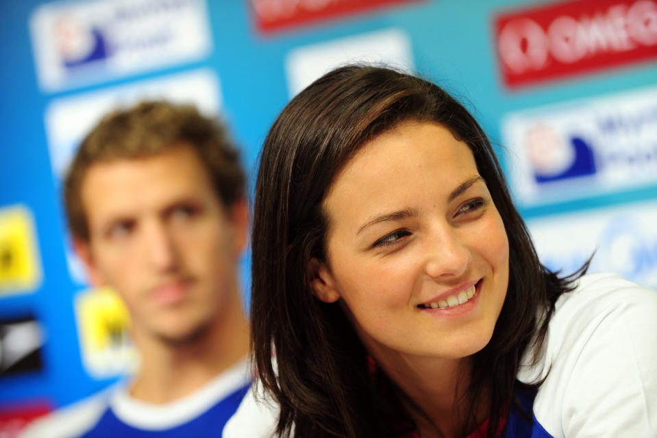 Britain's swimmer Keri-Anne Payne smiles next to Britain's competitor Adam Brown (L) during a press conference at the indoor stadium of the Oriental Sports Center during the FINA World Championships in Shanghai, on July 21, 2011. The FINA world championships' swimming events start on July 24, 2011. AFP PHOTO / MARK RALSTON (Photo credit should read MARK RALSTON/AFP/Getty Images)