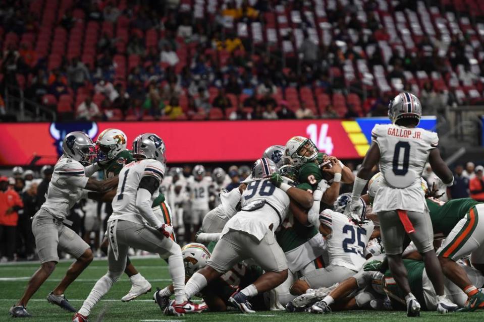 Florida A&M quarterback Jeremy Moussa runs the ball during the Cricket Celebration Bowl game between Florida A&M University and Howard University at Mercedes-Benz Stadium. (Credit: Katie Goodale-USA Today Network)