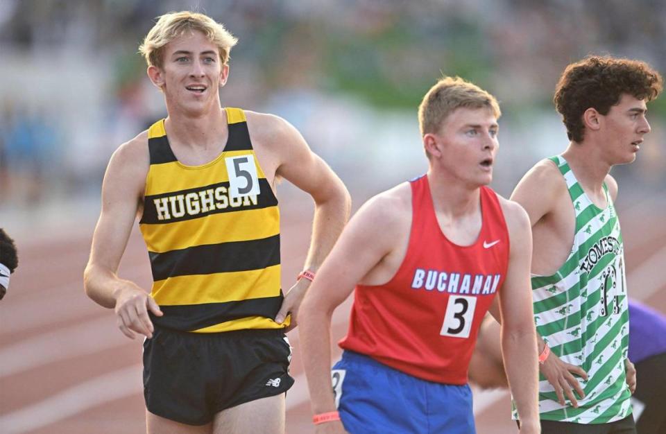 Hughson High School’s Joseph Lighthall, left, looks up to the scoreboard to see his first place finish time at the 2023 CIF California Track & Field State Championship finals Saturday, May 27, 2023 in Clovis.