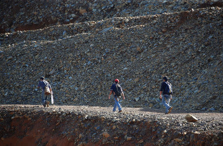 Workers walk inside nickel-ore mine Zambales Diversified Metals Corporation ordered closed by Environment secretary Regina Lopez in Sta Cruz Zambales in northern Philippines February 7, 2017. REUTERS/Erik De Castro