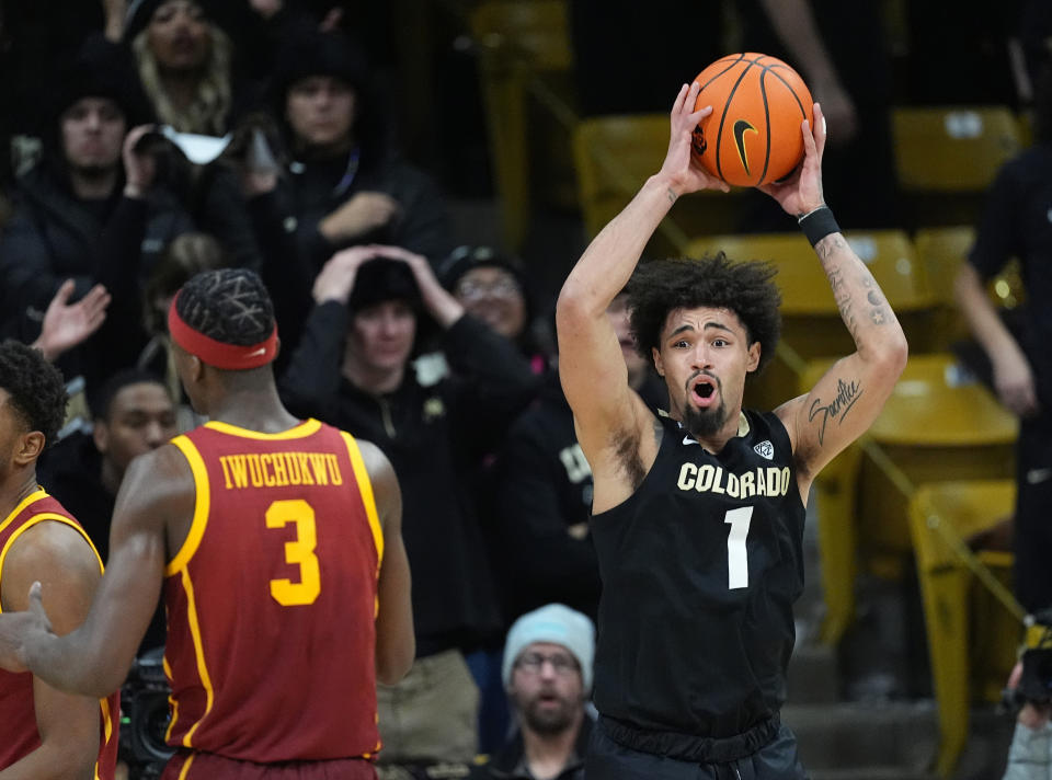 Colorado guard J'Vonne Hadley, right, reacts after being called for a foul on Southern California forward Vincent Iwuchukwu during the second half of an NCAA college basketball game Saturday, Jan. 13, 2024, in Boulder, Colo. (AP Photo/David Zalubowski)