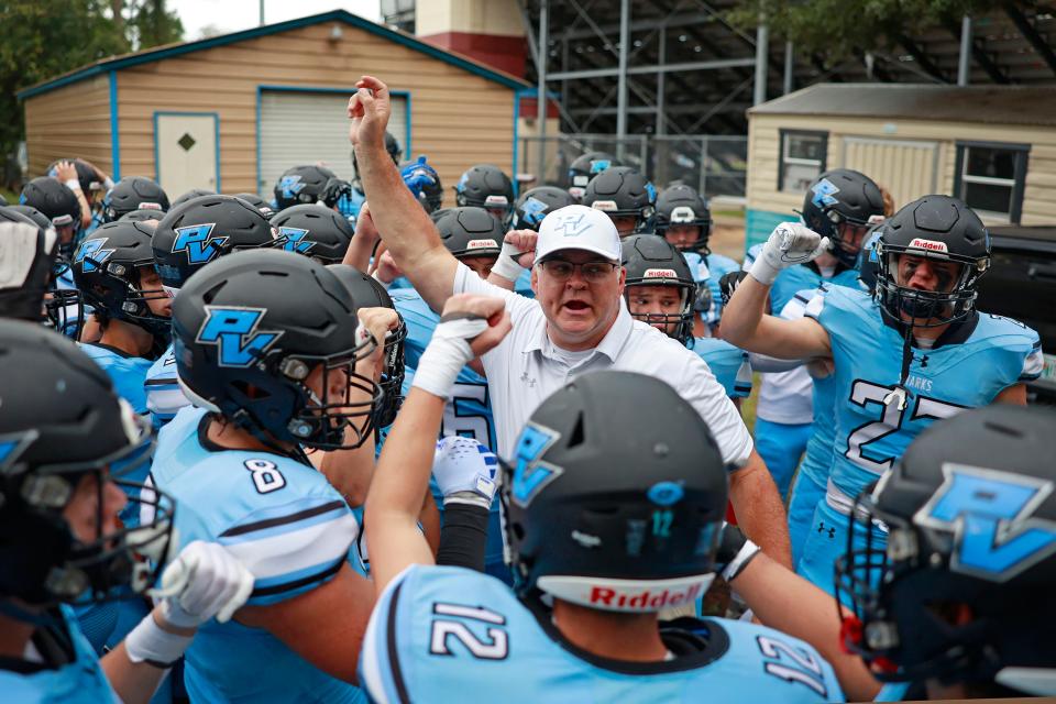 Ponte Vedra head coach Steve Price leads his team onto the field before a high school football matchup against the Middleburg Broncos Friday, Sept. 15, 2023 at Ponte Vedra High School in Ponte Vedra Beach, Fla. The Ponte Vedra Sharks shutout the Middleburg Broncos 35-0.