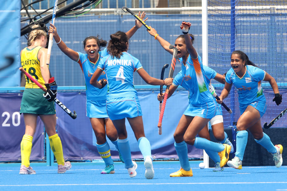 TOKYO, JAPAN - AUGUST 02: Monika, Navjot Kaur, Rani and Neha Neha of Team India celebrate the second goal scored while Jane-Anne Claxton of Team Australia walks away during the Women's Quarterfinal match between Australia and India on day ten of the Tokyo 2020 Olympic Games at Oi Hockey Stadium on August 02, 2021 in Tokyo, Japan. (Photo by Alexander Hassenstein/Getty Images)