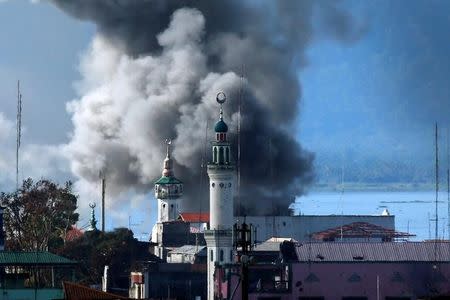 An explosion is seen after a Philippines army aircraft released a bomb during an airstrike as government troops continue their assault against insurgents from the Maute group in Marawi city June 27, 2017. REUTERS/Jorge Silva