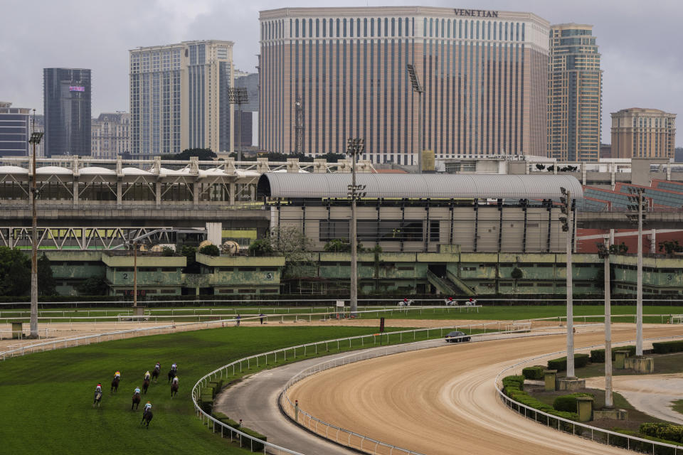 Jockeys compete in last Macao races at the Macao Jockey Club in Macao, Saturday, March 30, 2024. After more than 40 years, Macao’s horse racing track hosted its final races on Saturday, bringing an end to the sport in the city famous for its massive casinos. (AP Photo/Louise Delmotte)