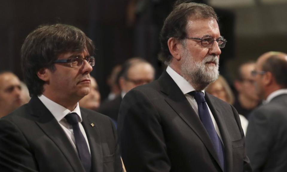 The president of Catalonia, Carles Puigdemont (left) and the Spanish prime minister, Mariano Rajoy, also attended the mass.