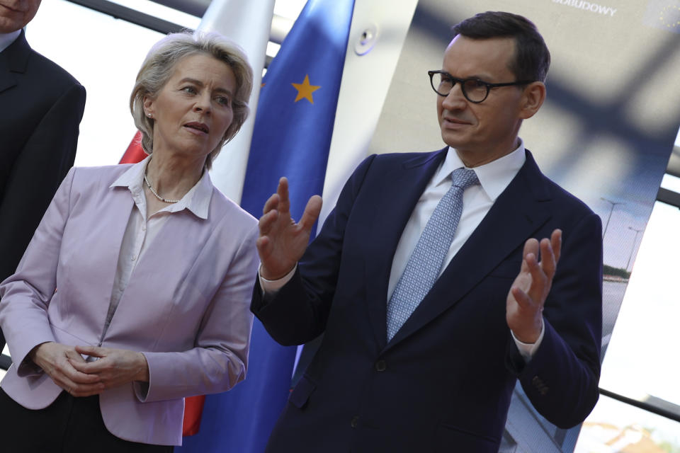 Poland's Prime Minister Mateusz Morawiecki, right, and European Commission President Ursula von der Leyen, left, arrive for a news conference at headquarters of Poland's Power Grid in Konstancin-Jeziorna, Poland, Thursday, June 2, 2022. The independence of Poland's courts is at the heart of a dispute with the European Union, which has withheld billions of euros in pandemic recovery funds. European Commission President Ursula von der Leyen meets Poland's leaders discuss the matter. (AP Photo/Michal Dyjuk)