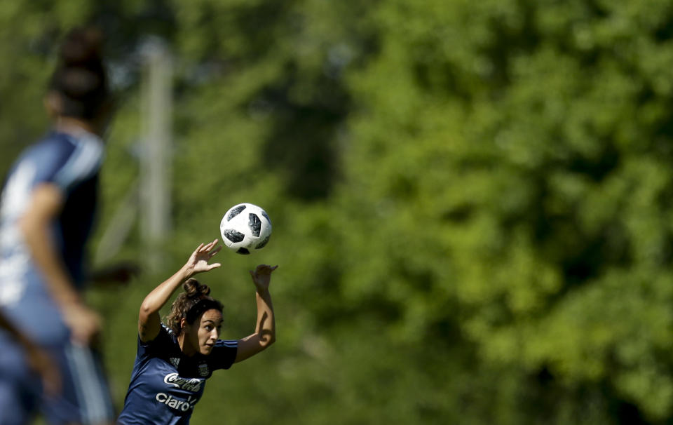 In this Nov. 1, 2018 photo, Argentina national female soccer team player Luana Munoz throws the ball during a training session at the Argentina Football Association, in Buenos Aires, Argentina. Argentina will play Panama on Thursday, Nov. 8, for a spot in the 24-team tournament. For the first time in the country's women's soccer history, the game will be played at a sold out stadium in Buenos Aires. (AP Photo/Natacha Pisarenko)