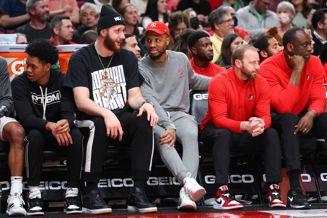 Jusuf Nurkic and Damian Lillard talk on the bench during a recent Portland Trail Blazers game. (Abbie Parr/Getty Images)