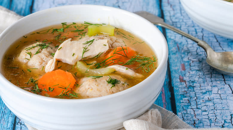 Matzah ball soup with chicken and dill