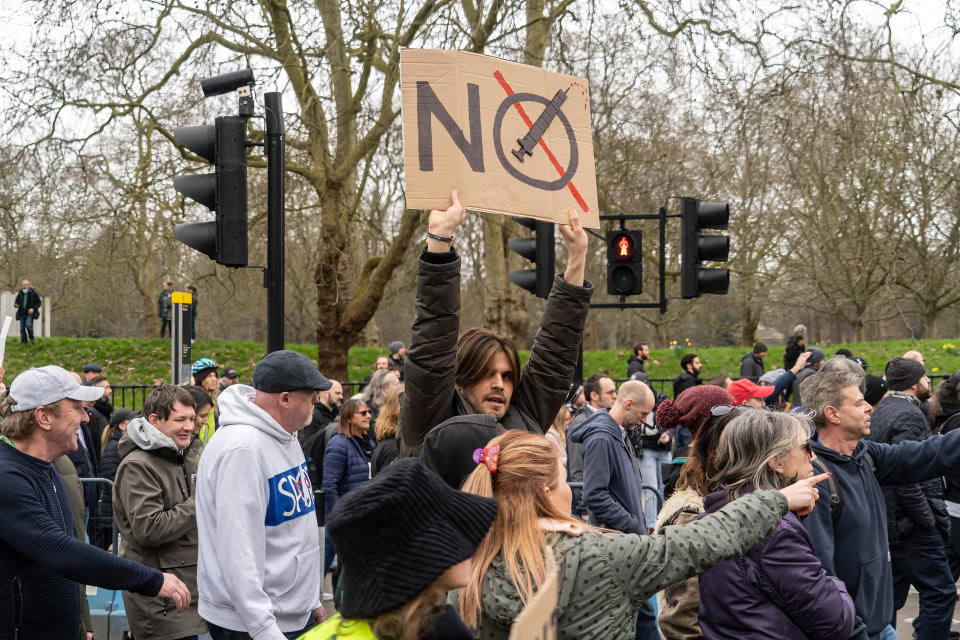 LONDON, UNITED KINGDOM - 2021/03/20: A protester holds an anti vaccine placard during the demonstration.
Huge numbers of protesters gathered in central London to protest the use of lockdowns in the UK and the implementation of the Police Bill. The demonstration marks one year since the UK entered into its first lockdown which was intended for 