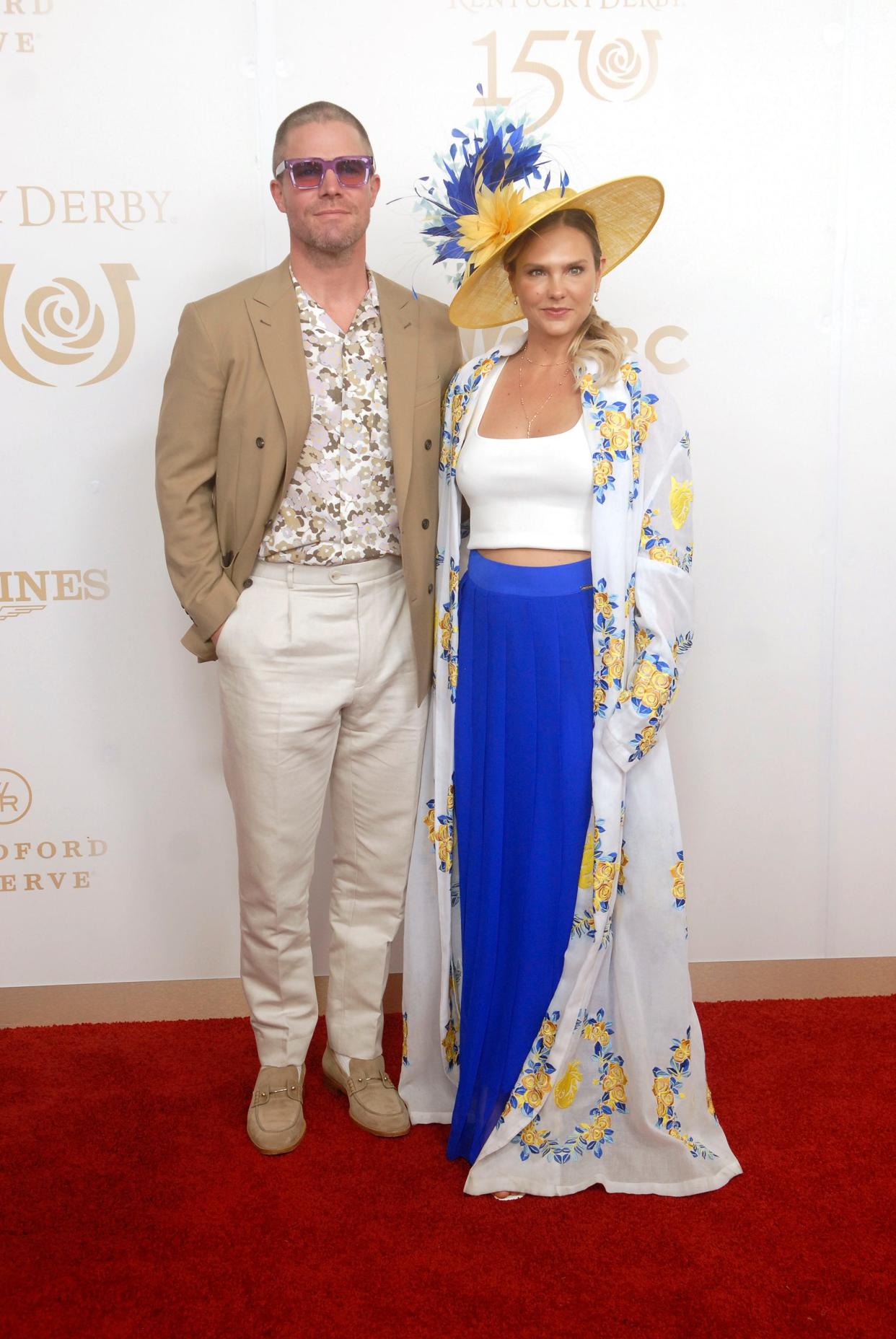 Actor Stephen Arnell, left, and his wife Cassandra Jean, right, poses on the 150th Kentucky Derby red carpet Saturday. May 04, 2024