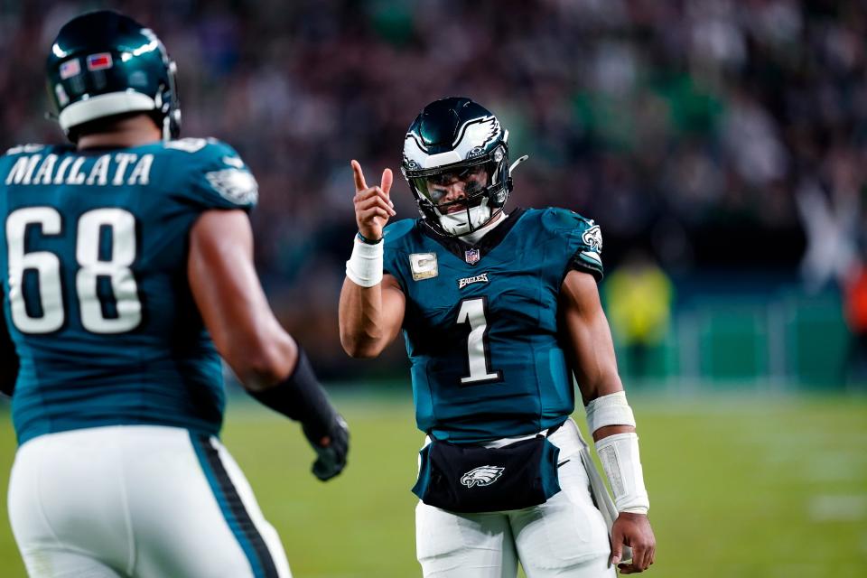 Philadelphia Eagles quarterback Jalen Hurts (1) reacts to his touchdown pass to Eagles' A.J. Brown (11) during the second half of an NFL football game against the Dallas Cowboys on Sunday, Nov. 5, 2023, in Philadelphia.