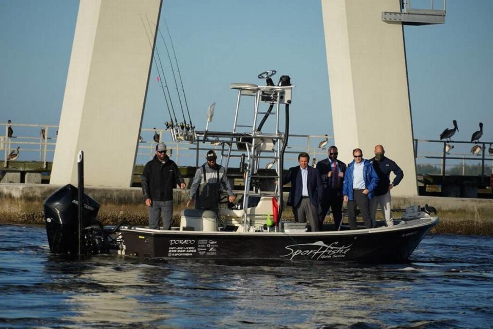 Gov. Ron DeSantis checks out water quality with fishermen in December 2020. Environmental groups have asked him to veto an IFAS budget line-item that would also halt local fertilizer bans, and a road-building research bill, both supported by the fertilizer industry.