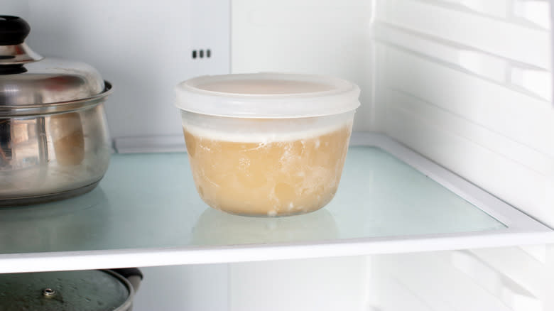 Container of stock in fridge