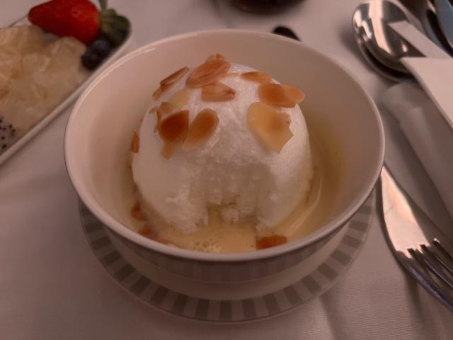 The &quot;floating island&quot; egg white dome with almonds and vanilla custard.