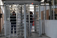 Workers leave the Unilever factory in Casalpusterlengo, near Lodi in Northern Italy, after being tested for virus infection Friday, Feb. 21,2020. Health officials reported the country's first cases of contagion of COVID-19 in people who had not been in China. A man hospitalized in Codogno works here. (AP Photo/Luca Bruno)