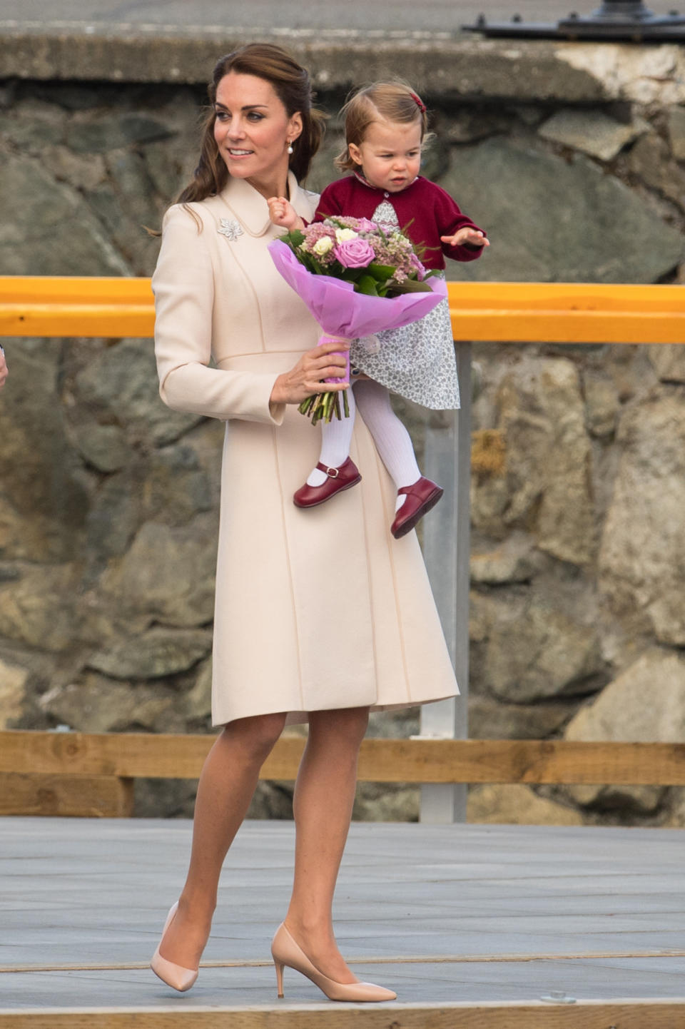 <p>As she bid farewell to Canada, the Duchess wore an elegant nude collared coat complete with matching satin heels. A maple leaf brooch - the emblem of Canada - proved a fitting accessory. </p><p><i>[Photo: PA]</i> </p>