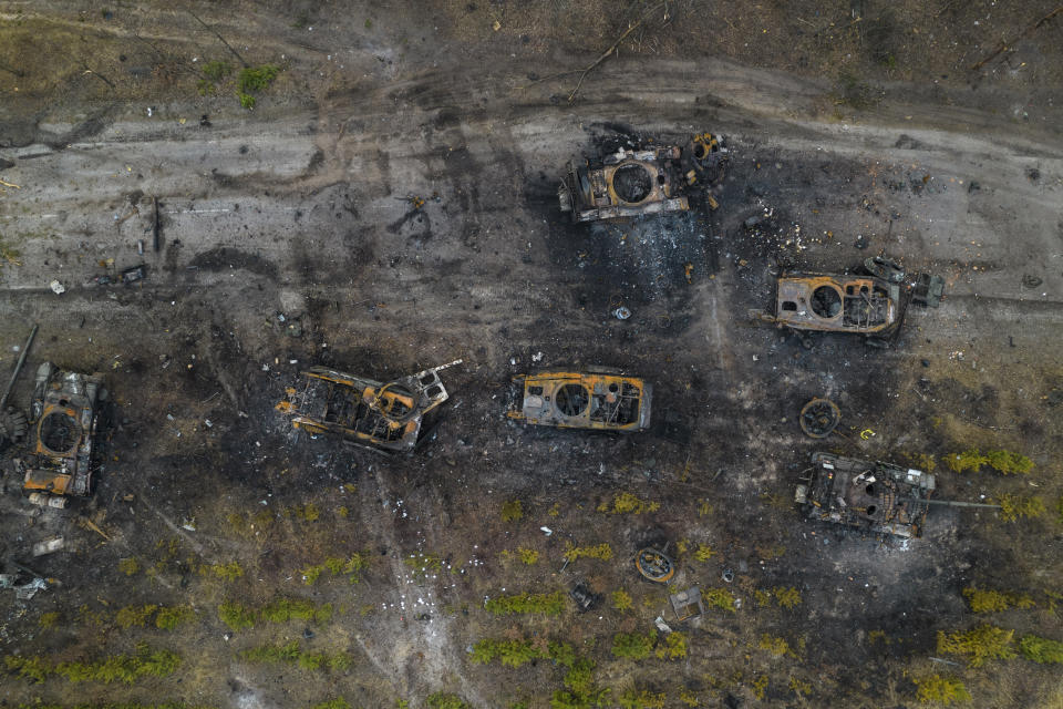 Destroyed Russian armored vehicles are seen in the outskirts of Kyiv, Ukraine, Thursday, March 31, 2022. Russian forces shelled Kyiv suburbs, two days after the Kremlin announced it would significantly scale back operations near both the capital and the northern city of Chernihiv to “increase mutual trust and create conditions for further negotiations.” (AP Photo/Rodrigo Abd)