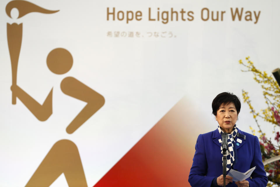 Tokyo Gov. Yuriko Koike delivers a speech during the Grand Start of the Olympic Torch Relay in Naraha, Fukushima prefecture, northeastern Japan, Thursday, March 25, 2021. The torch relay for the postponed Tokyo Olympics began its 121-day journey across Japan on Thursday and is headed toward the opening ceremony in Tokyo on July 23. (Kim Kyung-Hoon/Pool Photo via AP)