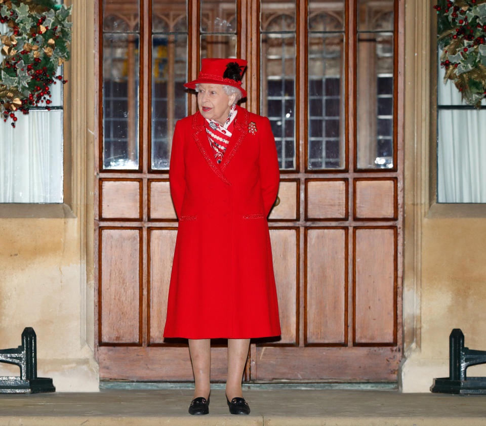 WINDSOR, UNITED KINGDOM - DECEMBER 08: (EMBARGOED FOR PUBLICATION IN UK NEWSPAPERS UNTIL 24 HOURS AFTER CREATE DATE AND TIME) Queen Elizabeth II attends an event to thank local volunteers and key workers from organisations and charities in Berkshire, who will be volunteering or working to help others over the Christmas period in the quadrangle of Windsor Castle on December 8, 2020 in Windsor, England. During the event members of the Royal Family also listened to Christmas carols performed by The Salvation Army Band. (Photo by Max Mumby/Indigo - Pool/Getty Images)