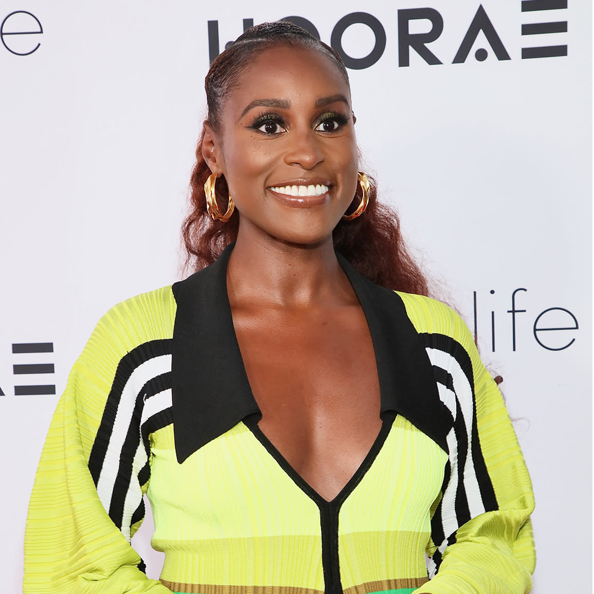  Issa Rae and a collage of her various businesses and investments.  