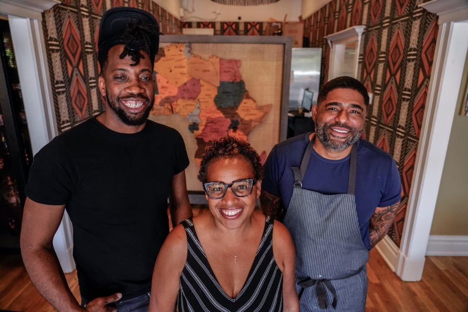 Will Brazil, general manager at Latha Restaurant & Bar, left, owner Evelia Davis, center, and Digby Stridiron, chef and co-owner, right, pose for a portrait at the restaurant located within the Diaspora Collective in Phoenix on April 19, 2023.