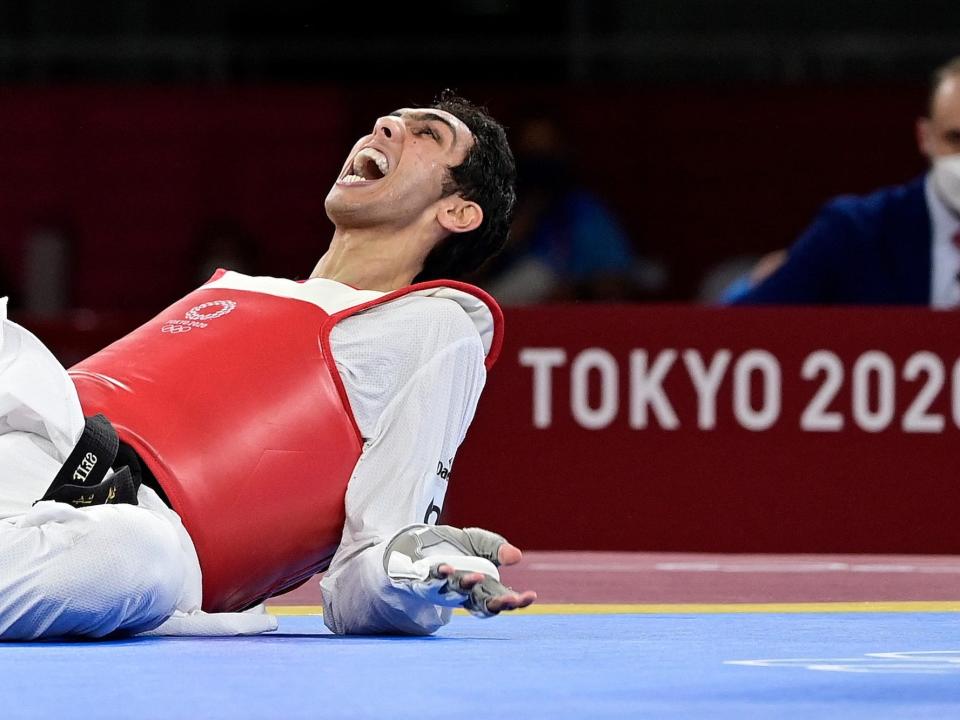 Egypt's Seif Eissa celebrates after winning bronze in taekwondo at the Tokyo Olympics.