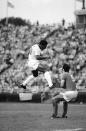 FILE - Pele reacts after heading the ball during a soccer match between the Cosmos and the Toronto Metro-Croatia in New York's Downing Stadium, June 19, 1975. Pelé, the Brazilian king of soccer who won a record three World Cups and became one of the most commanding sports figures of the last century, died in Sao Paulo on Thursday, Dec. 29, 2022. He was 82. (AP Photo/ Richard Drew, File)