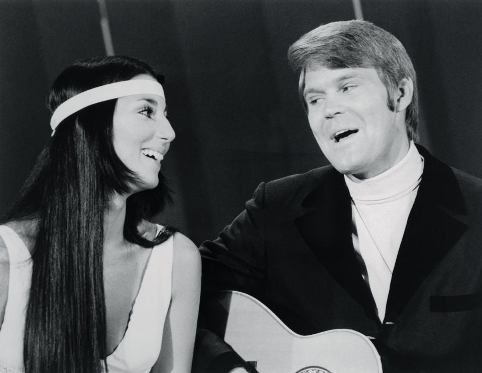 (Original Caption) Cher, of Sonny and Cher, sings a duet with Glen Campbell during a guest appearance on the Glen Campbell Goodtime Hour TV show.