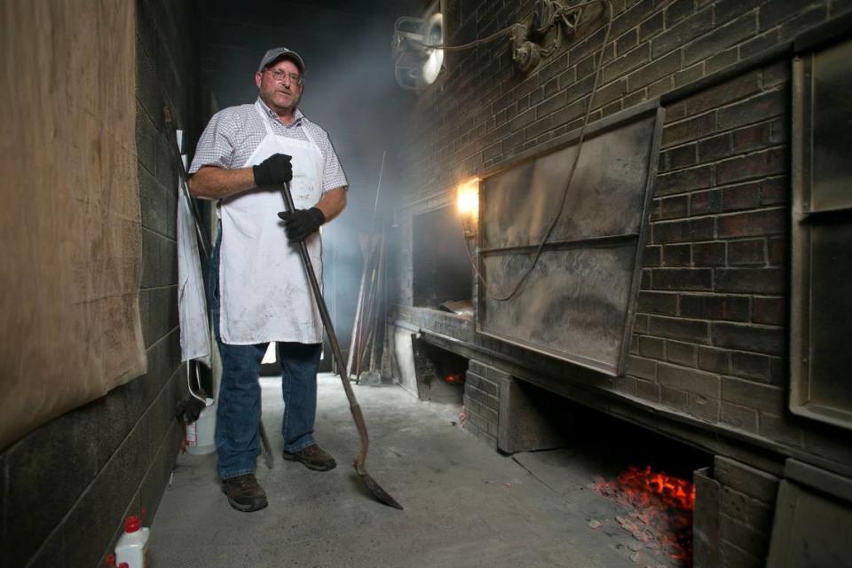 Owner Andy Stephenson works in the pit room at Stephensonâ€™s Bar-B-Q on Wednesday, July 27, 2016 on NC 50 north of Benson, N.C. Andyâ€™s father Williams Paul Stephenson opened the restaurant in 1958. He cooks pork shoulders on an open pit for hours and hours daily so the meat acquires a smoky flavor, before being chopped and served.