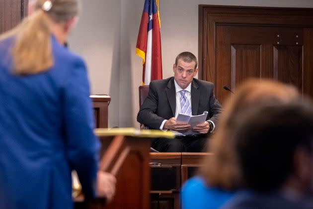 Glynn County Police Officer Jeff Brandeberry sits on the witness stand during the trial of Greg McMichael, his son Travis McMichael, and their neighbor William 