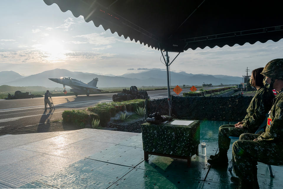 In this photo released by the Taiwan Presidential Office, Taiwanese President Tsai Ing-wen, second from right, watches as a military jet taxis along a highway in Jiadong, Taiwan, Wednesday, Sept. 15, 2021. Four military aircraft landed on the highway and took off again on Wednesday as part of Taiwan's five-day Han Guang military exercise designed to prepare the island's forces for an attack by China, which claims Taiwan as part of its own territory. (Taiwan Presidential Office via AP)