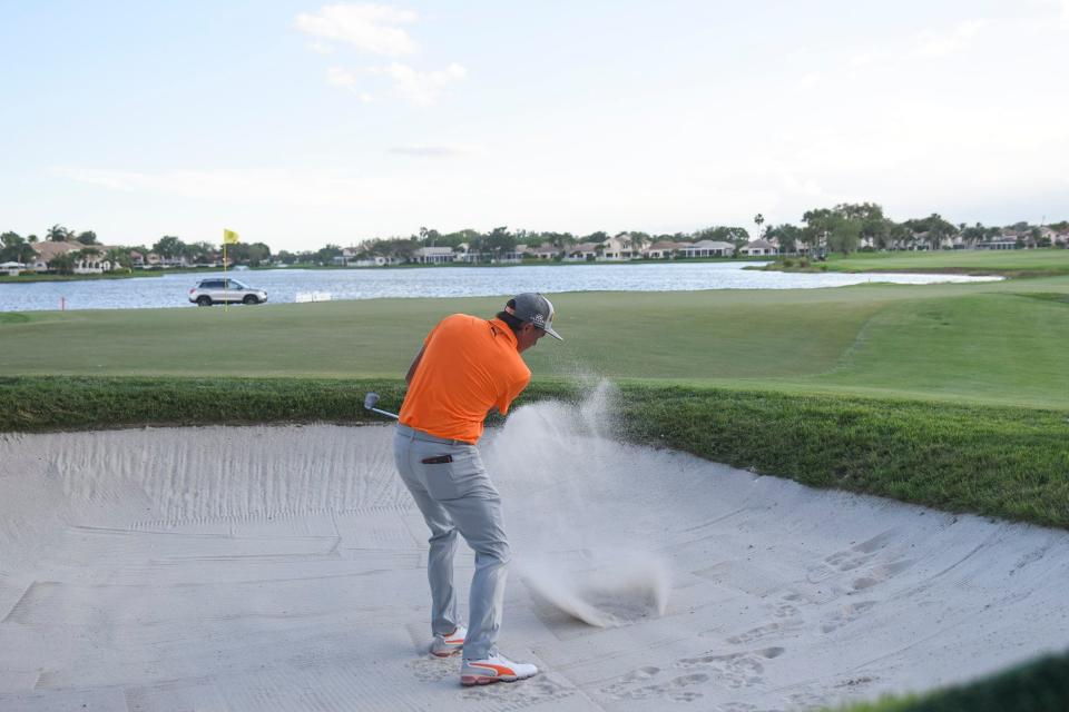 Rickie Fowler hits out of a sand trap on the 18th hole during the final round of the 2019 Honda Classic.