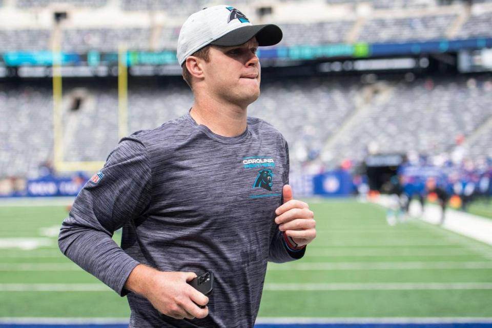 Panthers quarterback Sam Darnold jogs off the field after warming up before the game against the Giants at MetLife Stadium on Sunday, October 24, 2021 in Rutherford, NJ.