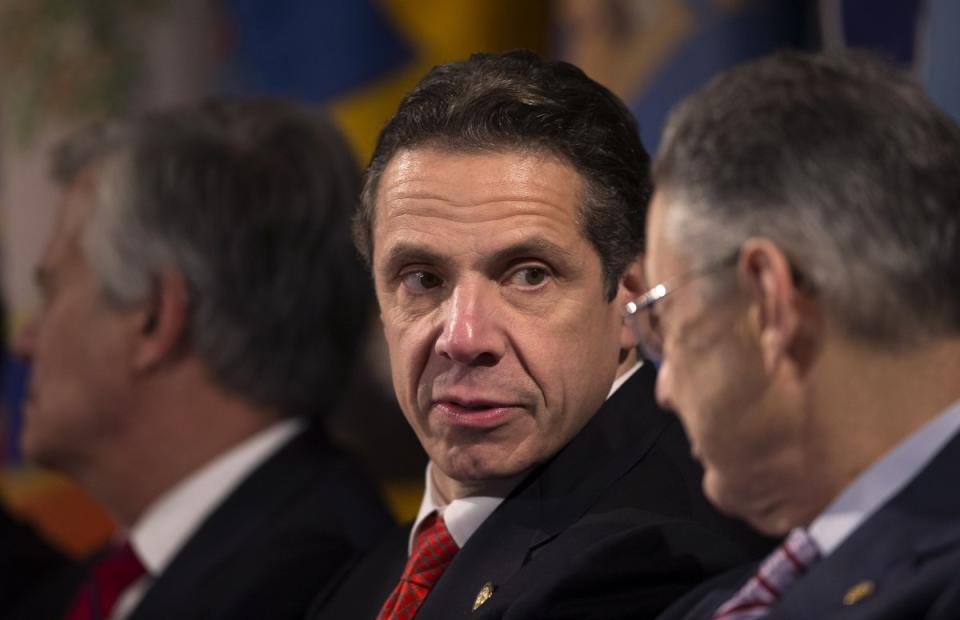 Andrew Cuomo (L) speaks to New York Assembly leader Sheldon Silver 