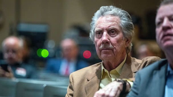 PHOTO: Robert Bigelow, owner of Budget Suites of America and Bigelow Aerospace, listens to Nevada Gov.-elect Joe Lombardo during an event with supporters at Rancho High School in Las Vegas, Nov. 14, 2022.  (Las Vegas Sun via AP)