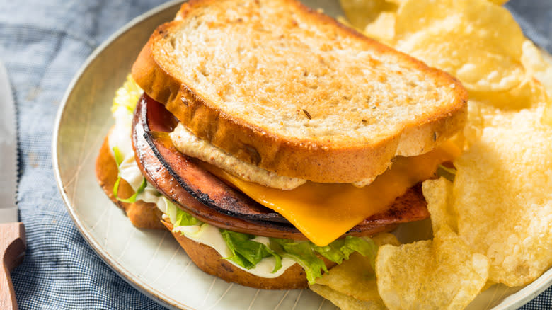 Fried bologna sandwich and chips